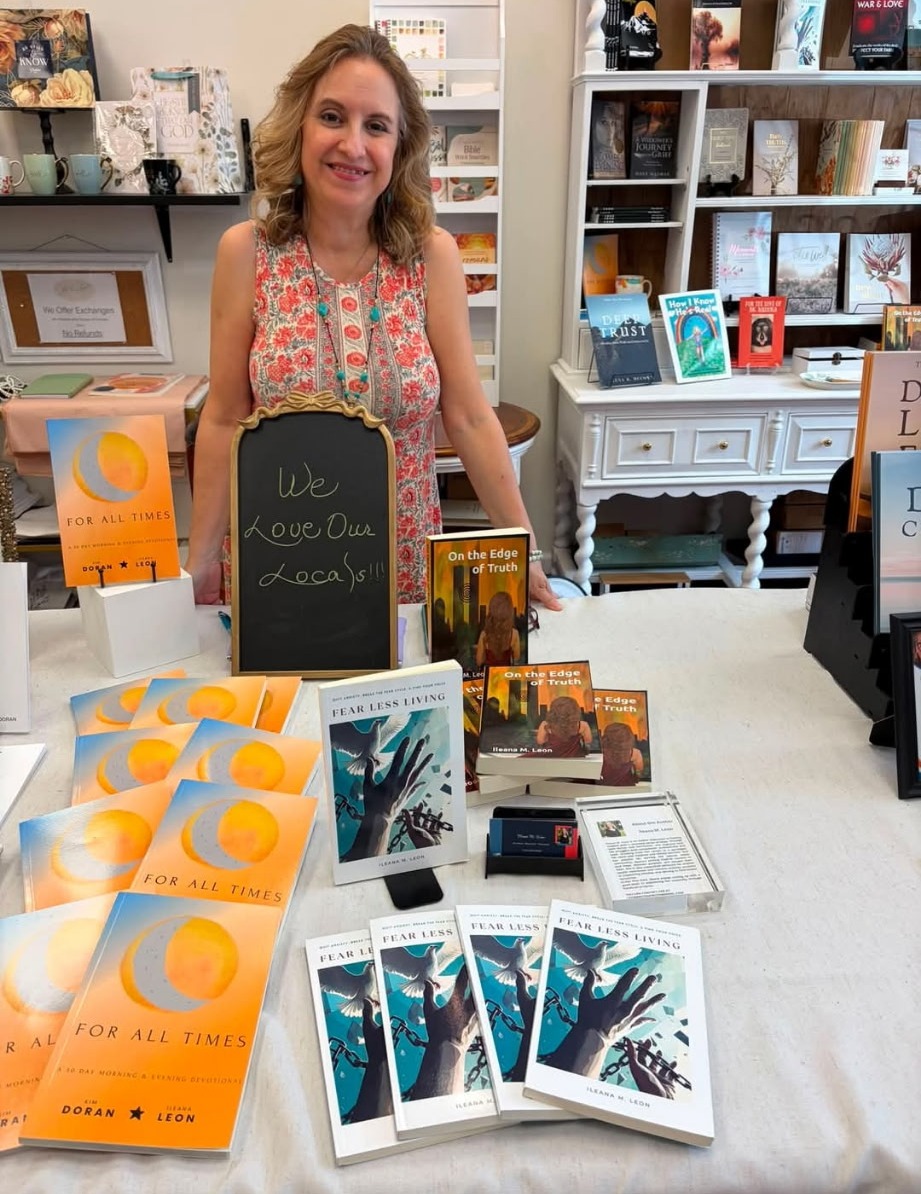 Ileana at her author table with all three of her books on display