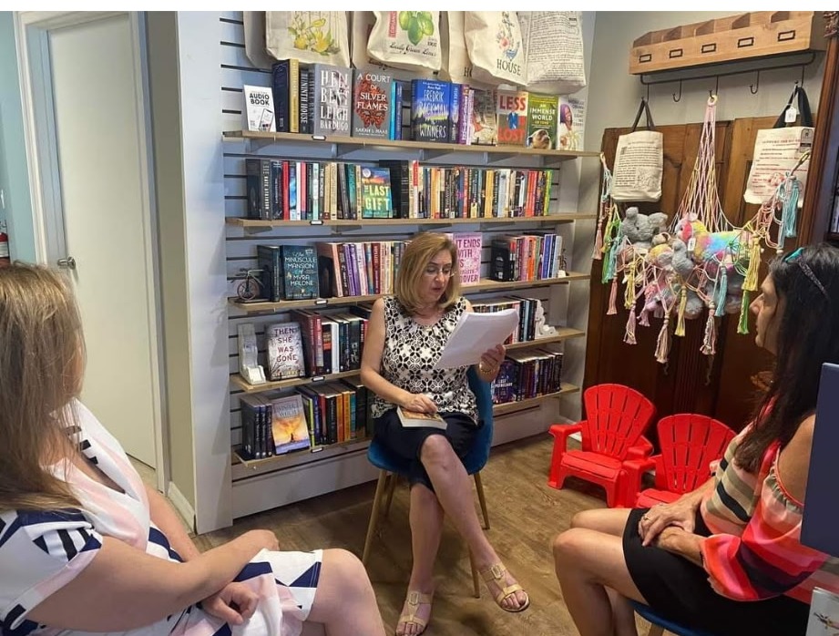 Ileana reading to a women's group at a bookstore